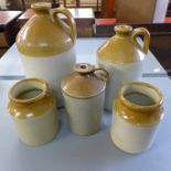 Three stoneware flagons and two stoneware jars