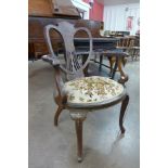 An Edward VII inlaid mahogany elbow chair