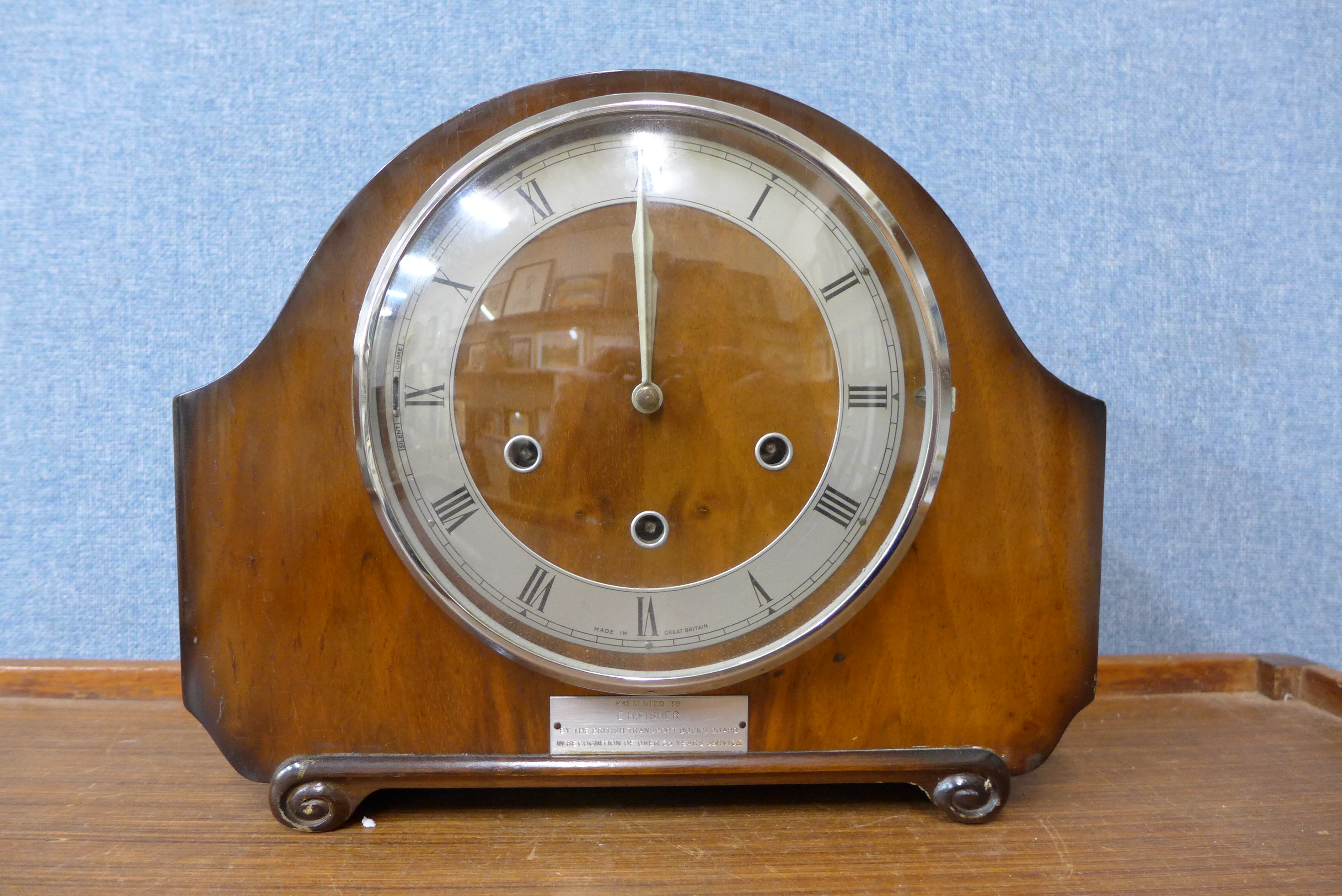 A walnut mantel clock