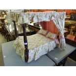 A doll's beech four poster bed