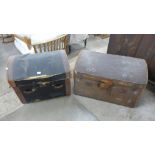 Two dome topped steamer trunks