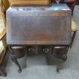 A Queen Anne style walnut bureau de dame