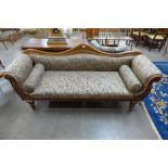 A Victorian walnut and upholstered scroll end settee