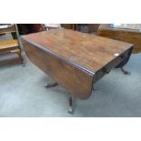 A Victorian mahogany pedestal drop leaf sofa table