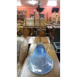 A hand blown glass and metal ceiling light