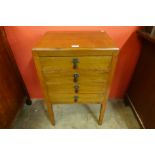 An early 20th Century mahogany music cabinet