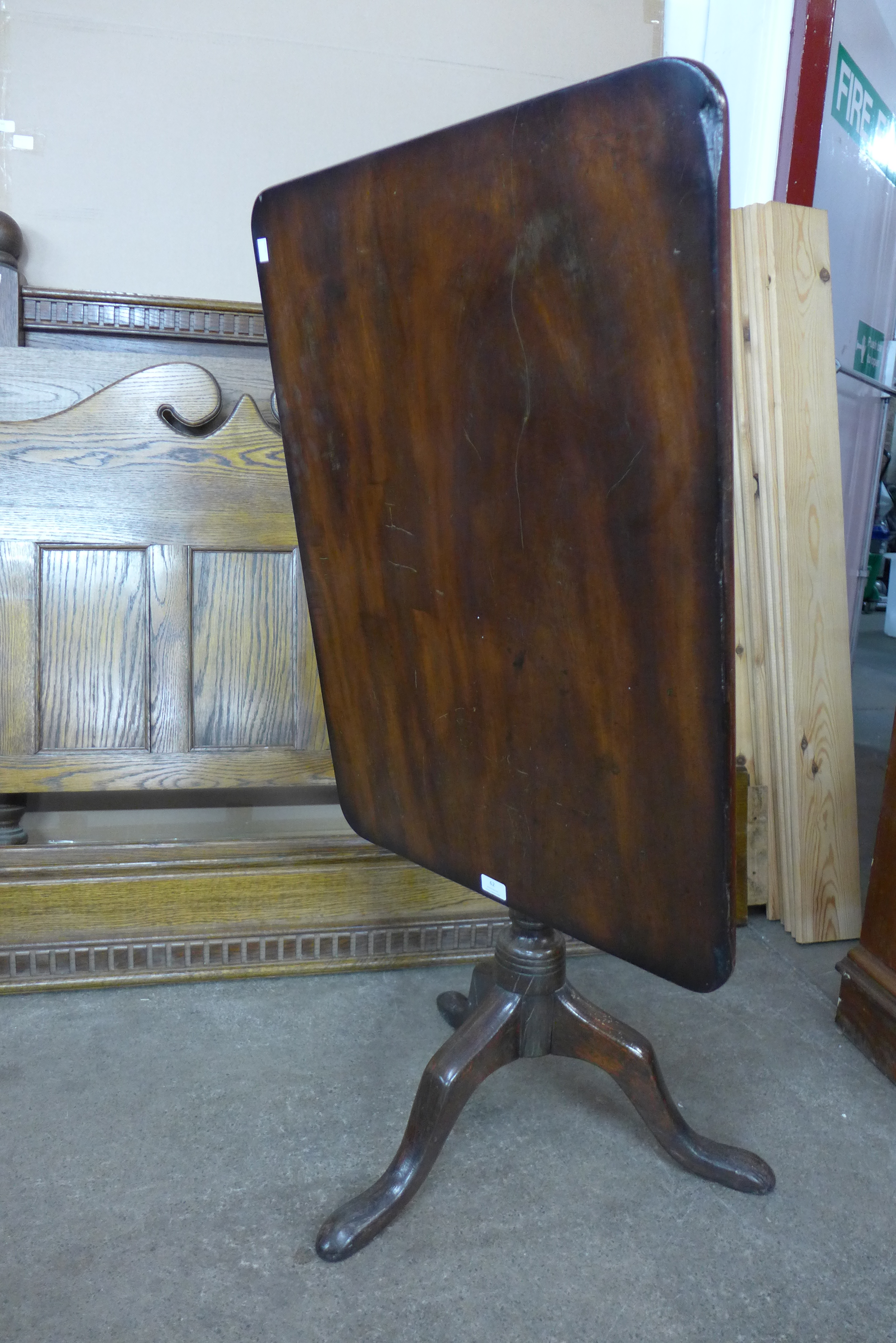 A Victorian mahogany rectangular tilt-top tripod table