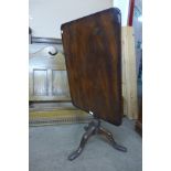 A Victorian mahogany rectangular tilt-top tripod table