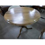 A George III style circular oak tilt-top tripod table