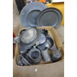 A box of assorted pewter ware