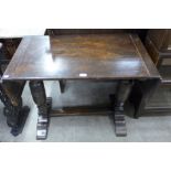 An oak drop-leaf pub table