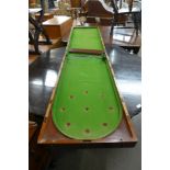 A Victorian mahogany folding bagatelle board