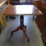 A Victorian mahogany rectangular tilt top tripod table