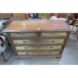 An Italian walnut and brass chest of drawers