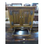 A small Old Charm oak two door cupboard