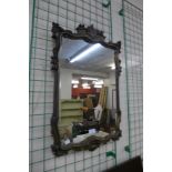 A gilt framed mirror