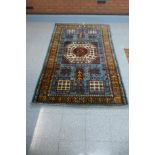 An eastern Caucasian patterned rug - 136cm x 216cm