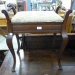 A mahogany piano stool