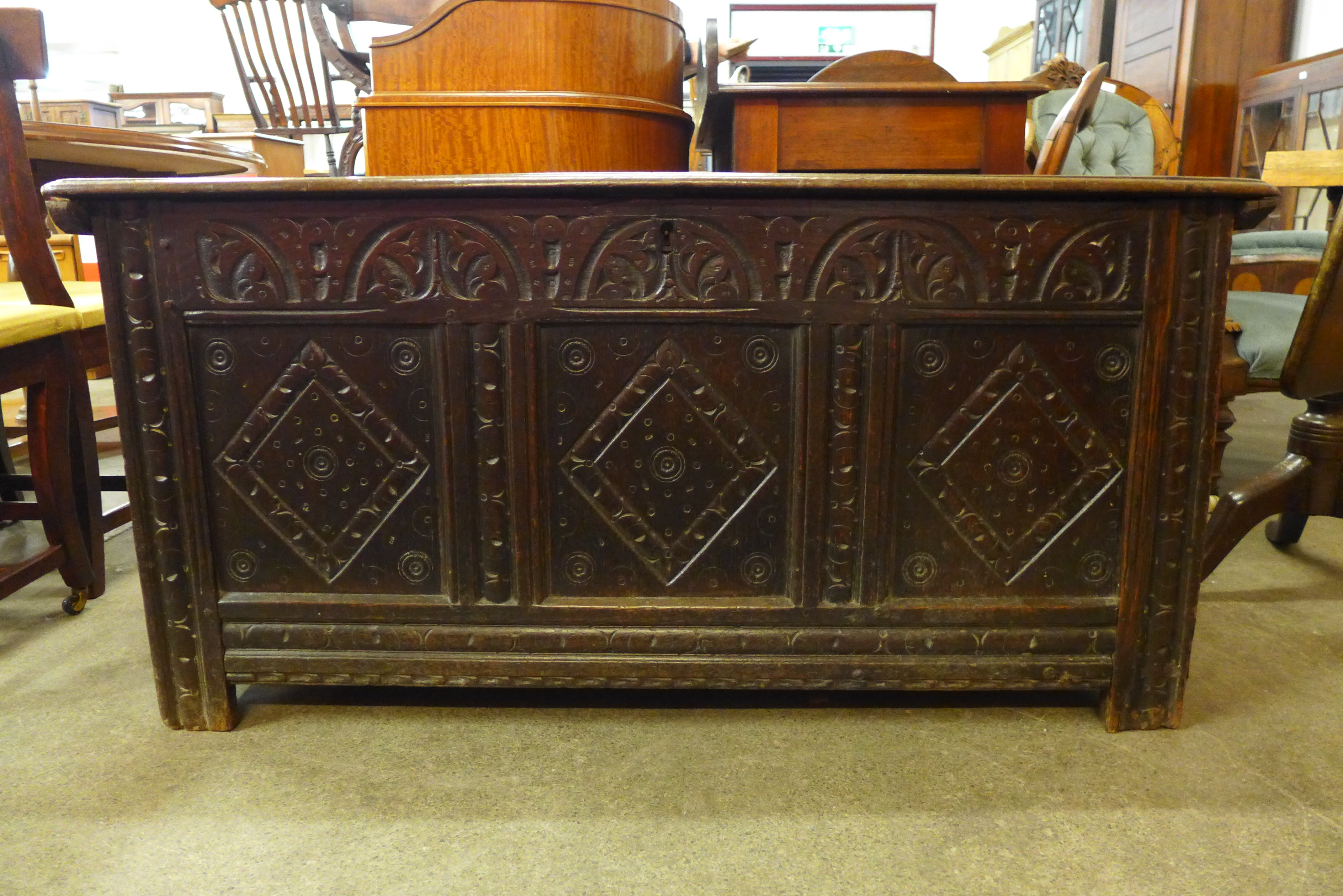 A Charles II carved oak coffer