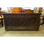 A Charles II carved oak coffer