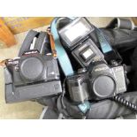 A Yashica FX-103 camera, a Yashica 108 multi program camera, a converter and a Cobra flash gun,
