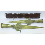 Two South Indian brass lance heads and a Middle Eastern carving knife