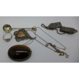 An Egyptian silver pendant, a tigers eye brooch, clips marked Holland, etc.