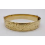 A 9ct gold bronze core bangle