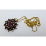 A gold backed Bohemian garnet pendant on a 9ct gold chain
