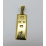 A 9ct gold ingot pendant set with a diamond, 5.