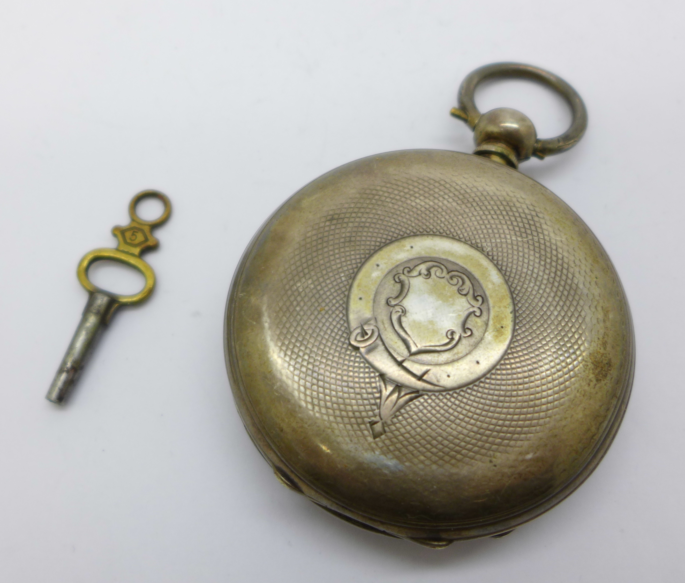 A silver pocket watch with silver dial and key - Image 2 of 2