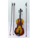 A Chinese student's violin and two bows