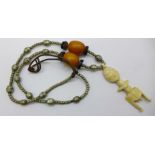 A large necklet with two amber beads