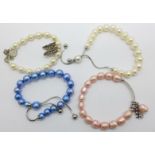 Four pearl bracelets