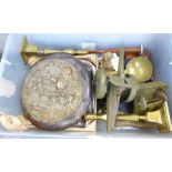 A box of assorted items including a toy tank, a pair of brass candlesticks, etc.