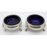 A pair of George III silver salts with blue glass liners, one liner replaced,