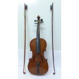 A cased violin and two bows, Antonio Stradivarius label,
