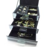 Fashion jewellery in a mirrored three drawer cabinet, 1.