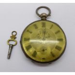 A silver pocket watch with silver dial and key