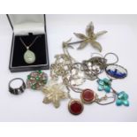 A collection of silver jewellery including a pair of enamel earrings,