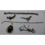 Two silver bracelets, fasteners a/f, a silver neck chain, a silver tigers eye pendant,