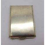 A silver match book holder,