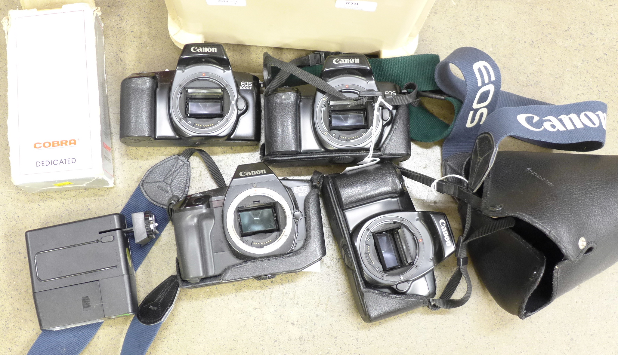 Three Canon EOS 1000F camera bodies, one Canon EOS650 camera body,
