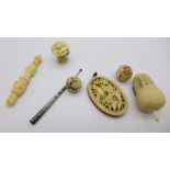 Needlework items including two tape measures and a carved ivory pin cushion