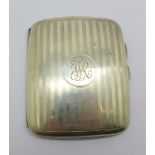 A silver cigarette case, 69.