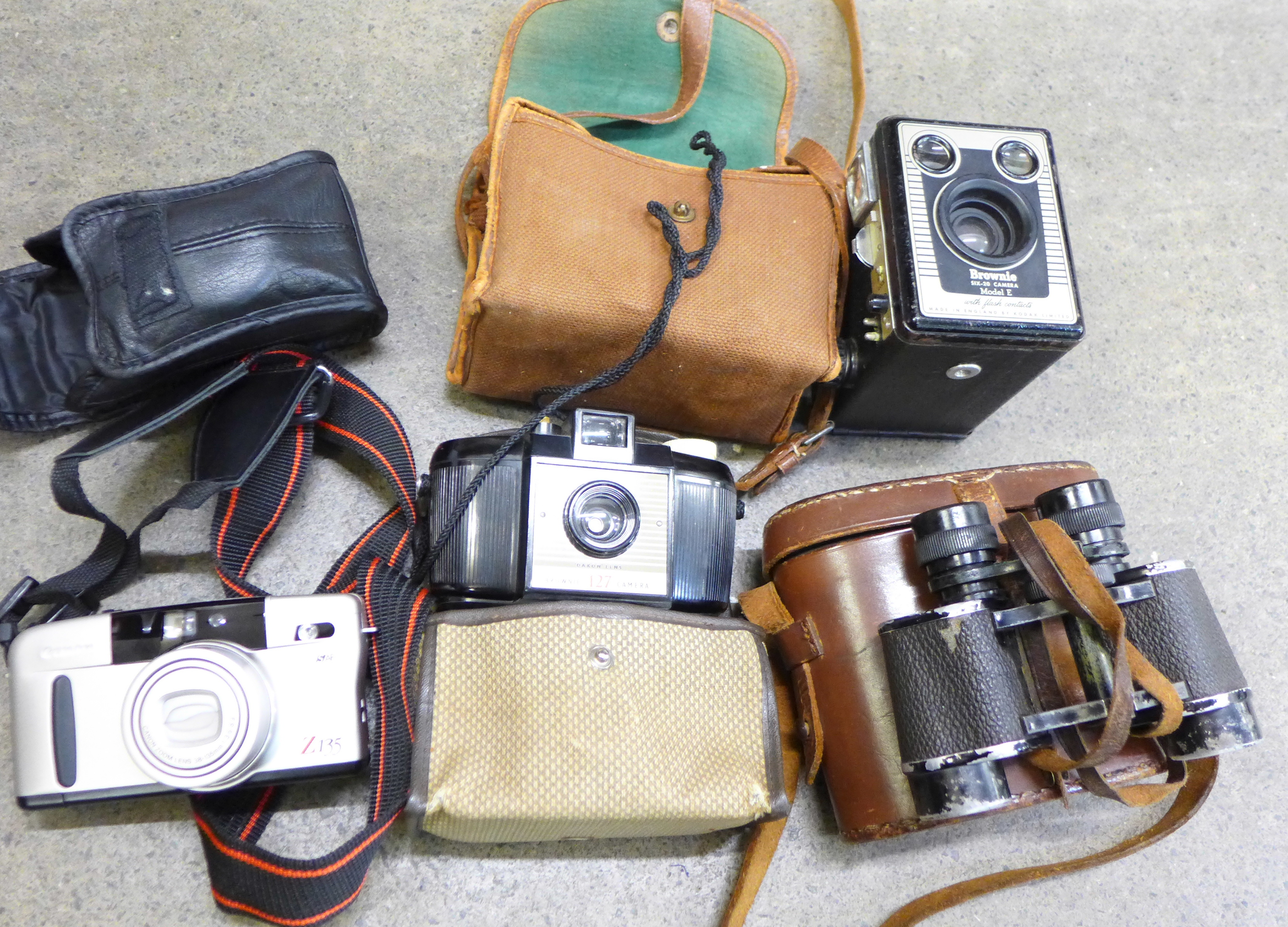 A pair of Aubrey Franks binoculars, 8x25 optics, cased,