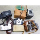 A pair of Aubrey Franks binoculars, 8x25 optics, cased,