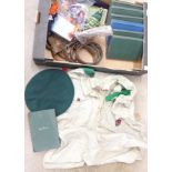 A collection of Scout and Girl Guide items including belts, badges,