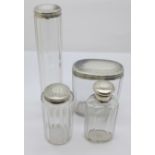 Four Victorian silver top glass bottles