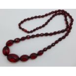 A string of faceted red beads
